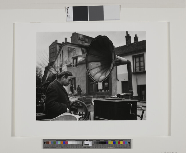 Alternate image #1 of La Musique des Puces (Music of the Flea Market), number 13 of 15, from the portfolio Robert Doisneau