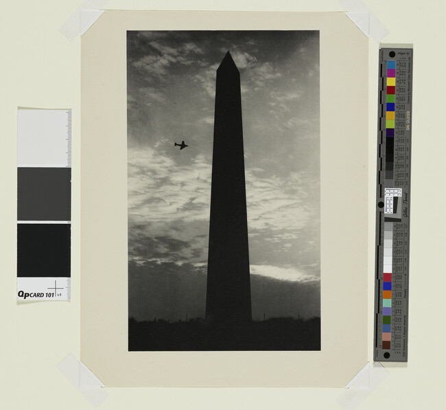 Alternate image #1 of Washington Monument with passing airplane
