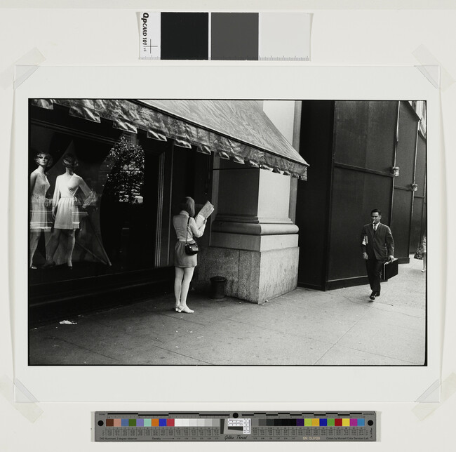 Alternate image #1 of Woman Reading Paper, number 12, from the portfolio Garry Winogrand