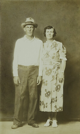 Man in Hat with a  Woman in Flowered Dress