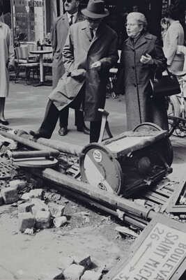 Man and Woman standing near debris on Paris boulevard near the Sorbonne, May 11, 1968