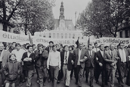 Student leaders Alain Geismar (arms crossed), Daniel Cohn-Bendit (hands in front of his face), and...