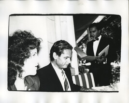 Claudia Cohen, an Unidentified Man and a Waiter