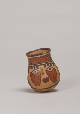 Miniature Vessel depicting a Human Face (one of a pair)