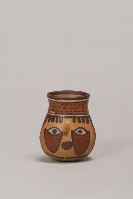Miniature Vessel depicting a Human Face (one of a pair)