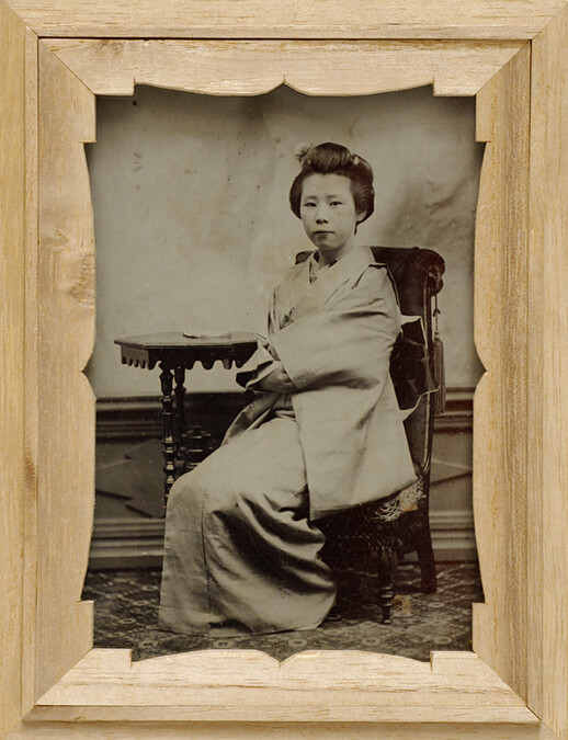 Portrait of a Geisha Seated Before a Table