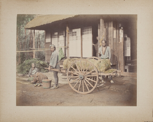 Untitled (Two Figures with a cart of straw), from a Photograph Album