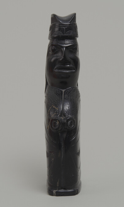 Argillite Carving of a Kneeling Figure wearing a Ceremonial Hat and a Robe