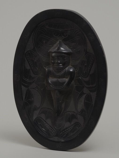 Argillite Oval Platter depicting a Shaman Figure in High Relief Transforming into a Dogfish (Shark)