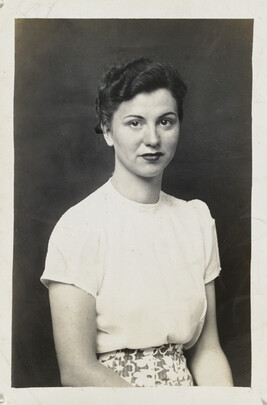 A woman wearing a White Blouse and Floral Skirt