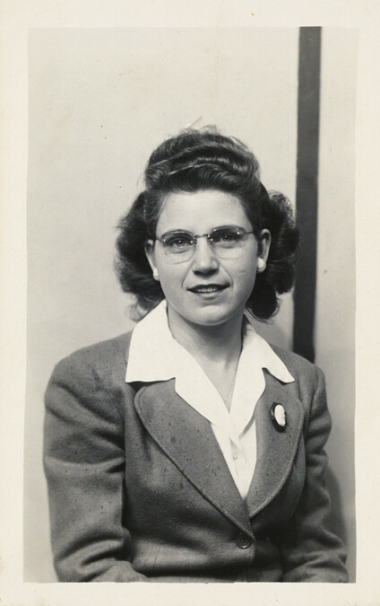 Woman wearing a Suit and Cameo Pin