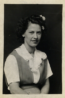 Woman wearing a Jumper with a Ruffled Blouse