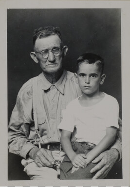 Older Man with Young Boy Seated on his Lap