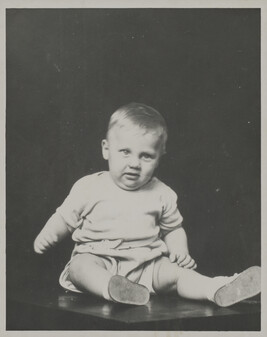 Little Boy Seated on a Table