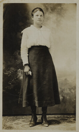 Woman in White Shirt and Dark Skirt (cloud background)