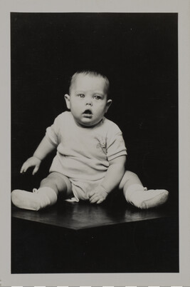 Baby on Seated on a Table