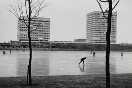 Skaters and Walkers on Frozen Canal with Modern Buildings in Background, Amsterdam, Holland