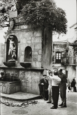 Men Have a Lively Discussion on the Street, Sicily, Italy
