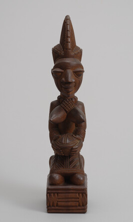 Yoruba Kneeling Female Figure Holding a Bowl