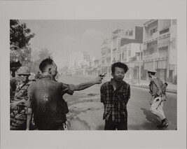 General Nguyen Ngoc Loan, South Vietnamese Chief of the National Police, fires his pistol into the head...