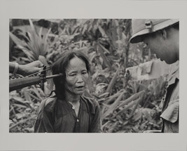 A Viet Cong Suspect is Questioned at Gunpoint by a South Vietnamese Police Offer at Tam Ky, November 1967