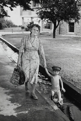 Woman Walking with Boy in Small Canal, Freiburg, West Germany