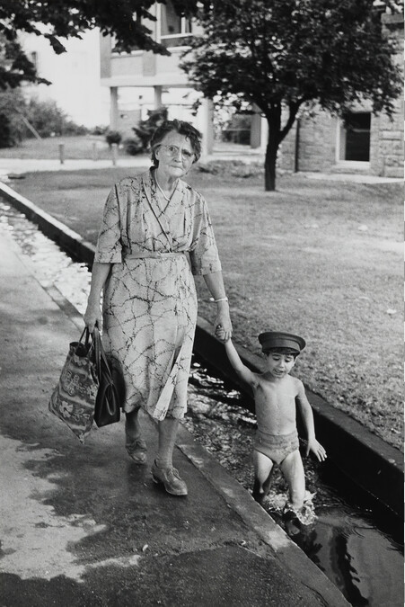 Woman Walking with Boy in Small Canal, Freiburg, West Germany