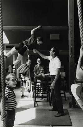 Boy climbing in gymnasium, London, England