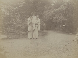Western man with two Japanese girls. Yokohama, Kanagawa Prefecture, Japan, from a Travel Photograph...