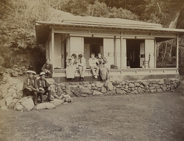 Four Western tourists with three Japanese men outside a tea house. Enoshima, Kanagawa Prefecture, Japan,...