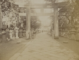 Three men standing next to a torii (Japanese gate). Japan, from a Travel Photograph Album (Views of...