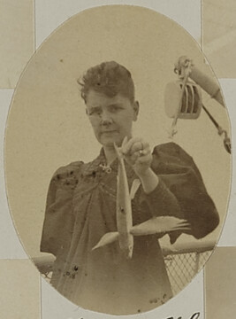 Woman holding a flying fish. Hawaii, from a Travel Photograph Album (Views of Hawaii and Japan)