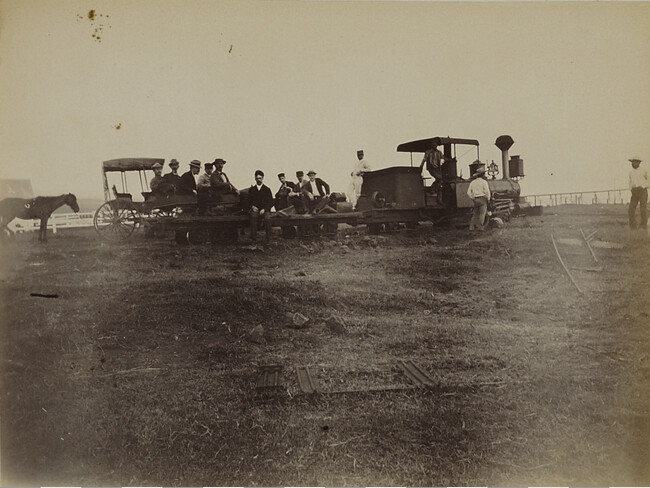 Men on a train on the Punalu'u railroad. Hawaii (island), Hawaii, from a Travel Photograph Album (Views of Hawaii and Japan)