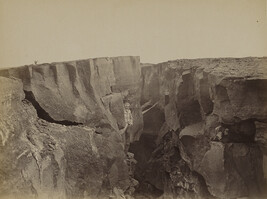 Man standing in a crack in a crater of Kīlauea. Hawaii (island), Hawaii, from a Travel Photograph Album...