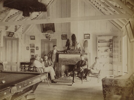 Five men in the lounging room at Volcano House. Hawaii (island), Hawaii, from a Travel Photograph Album...