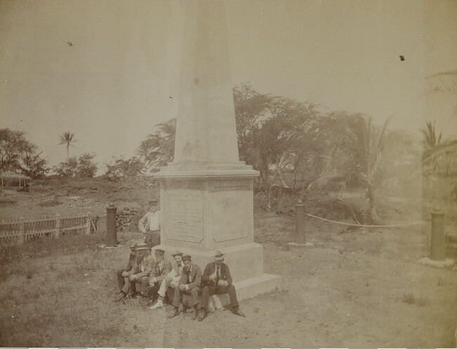 Seven men at the Captain Cook Monument. Kealakekua, Hawaii (island), Hawaii, from a Travel Photograph Album (Views of Hawaii and Japan)
