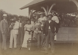 Men and women at the home of John S. McGrew. Honolulu, O'ahu, Hawaii, from a Travel Photograph Album...