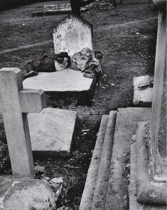 Two Young Men Sleeping on a Gravestone, Lagos, Nigeria