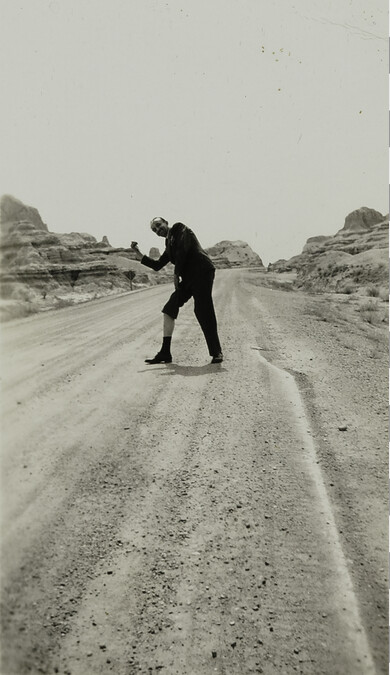 Man Hitchhiking with Pant Leg Raised [reference to: It Happened One Night; Claudette Colbert Hitchhiking scene]