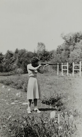 Woman Firing a Rifle