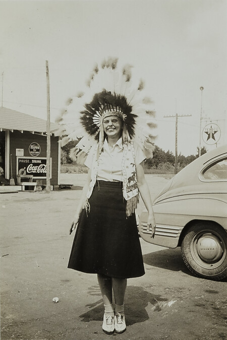 Young Woman with Plains-style Headdress and Beaded Vest