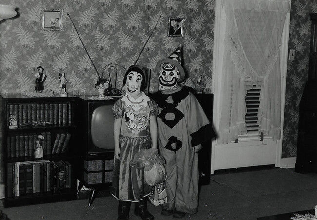 Two Children in Halloween Costumes