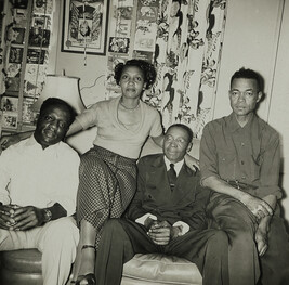 Woman and Three Men in Living Room