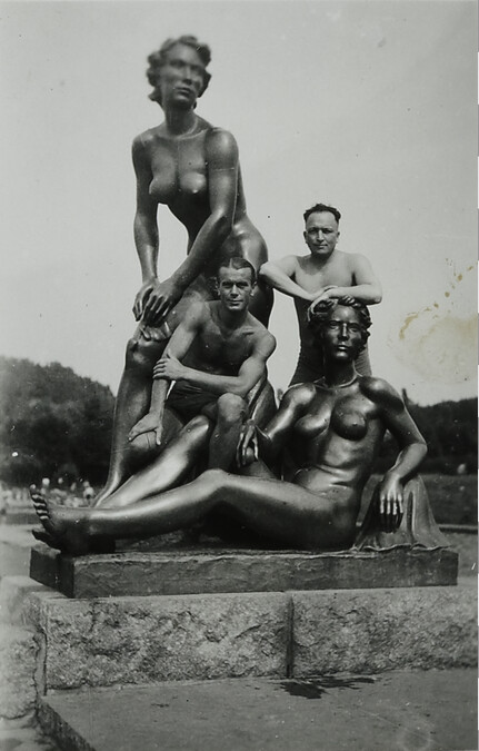 Two Men with Nude Female Statues