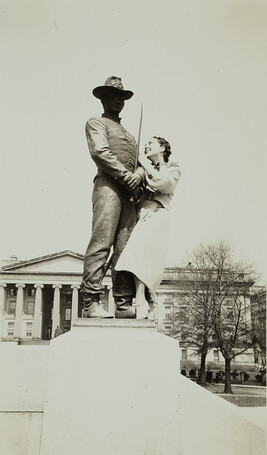 Woman Posing with a Statue