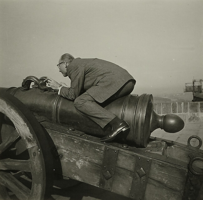 Man Straddling a Cannon