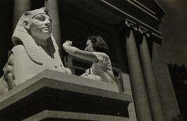 Woman Taking Picture of Egyptian-Style Statue
