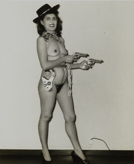 Nude Woman Wearing a Cowboy Hat and Holding Pistols