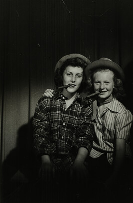 Two Women Wearing Hats and with Cigars