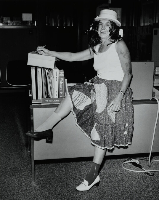 Figure Dressed in Skirt and High Heels, Hat, and Wig